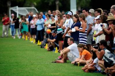 parents watching a youth soccer tournament from the sidelines